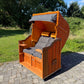 Strandkorb Sonnenpartner Modell Classic PE orange im Freien, Dessin Panama Schwarz, ideal zum Entspannen.