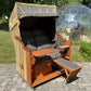 Strandkorb Sonnenpartner Modell Classic PE naturoptik mit gepolsterten Sitzen und Fußstütze, ideal für den Garten.