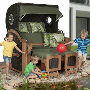 Strandkorb devries Aruba XL Rope anthrazit mit grünem Palmenblatt-Muster, Kinder spielen fröhlich davor im Garten