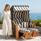 Strandkorb SunnySmart Rustikal 250 Plus anthrazit mit Dessin 1180 gestreift auf Terrasse mit Meerblick, 2-Sitzer Liegemodell