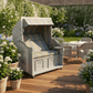 Strandkorb Sonnenpartner Modell Classic XL PE Geflecht antik-weiss in einem Garten mit Blumen und Terrassensitz.