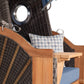Strandkorb deVries PURE Seemöwe Teak PE stone grey 1-Sitzer Detail mit Bullauge, Armlehne und blauem Kissen, Dessin 509
