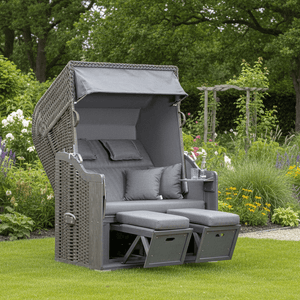 Strandkorb SunnySmart Rustikal 255 Plus grau mit PVC-Geflecht und Fußstützen im blühenden Garten, gemütlicher 2-Sitzer Strandkorb