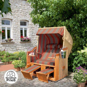 Strandkorb Sonnenpartner Classic PE Geflecht Rattanoptik mit Nackenrollen und Fußstützen im Garten vor Steinhaus, Dessin 28