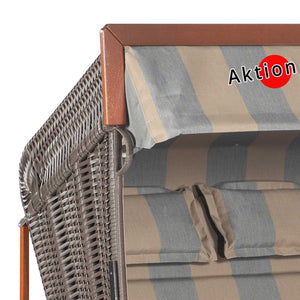 Strandkorb Sonnenpartner Modell Präsident mit gestreiftem Dach und Holzrahmen, ideal für entspannte Sommertage.