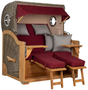 Strandkorb Baltikum Bullaugen Teak Geflecht PE grey 2,5-Sitzer XL mit roten Kissen und Holzfußstützen