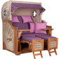 Strandkorb Mr. Deko Düne Bullaugen Teak PE shell 2-Sitzer mit lila Kissen und Holzdetails.