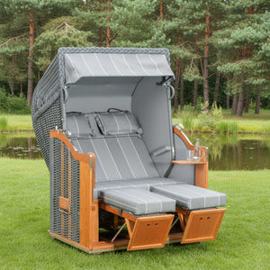 Strandkorb Sonnenpartner Classic PE Geflecht onix mit Fahrrollen, Komfortkopfkissen und höhenverstellbaren Fußstützen am Gartenteich