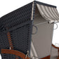 Strandkorb mit anthrazitfarbener PVC-Beschichtung und gestreifter Abdeckung, ideal für den Strand und entspannende Momente.