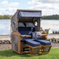 Strandkorb deVries Sailor PURE Teak XL PE white kubu Dessin 198 mit Bullaugen und blauen Polstern am Seeufer